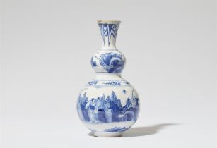 A faience gourd vase with Chinoiserie decor
