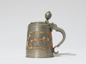A small Kulmach pewter-mounted tankard