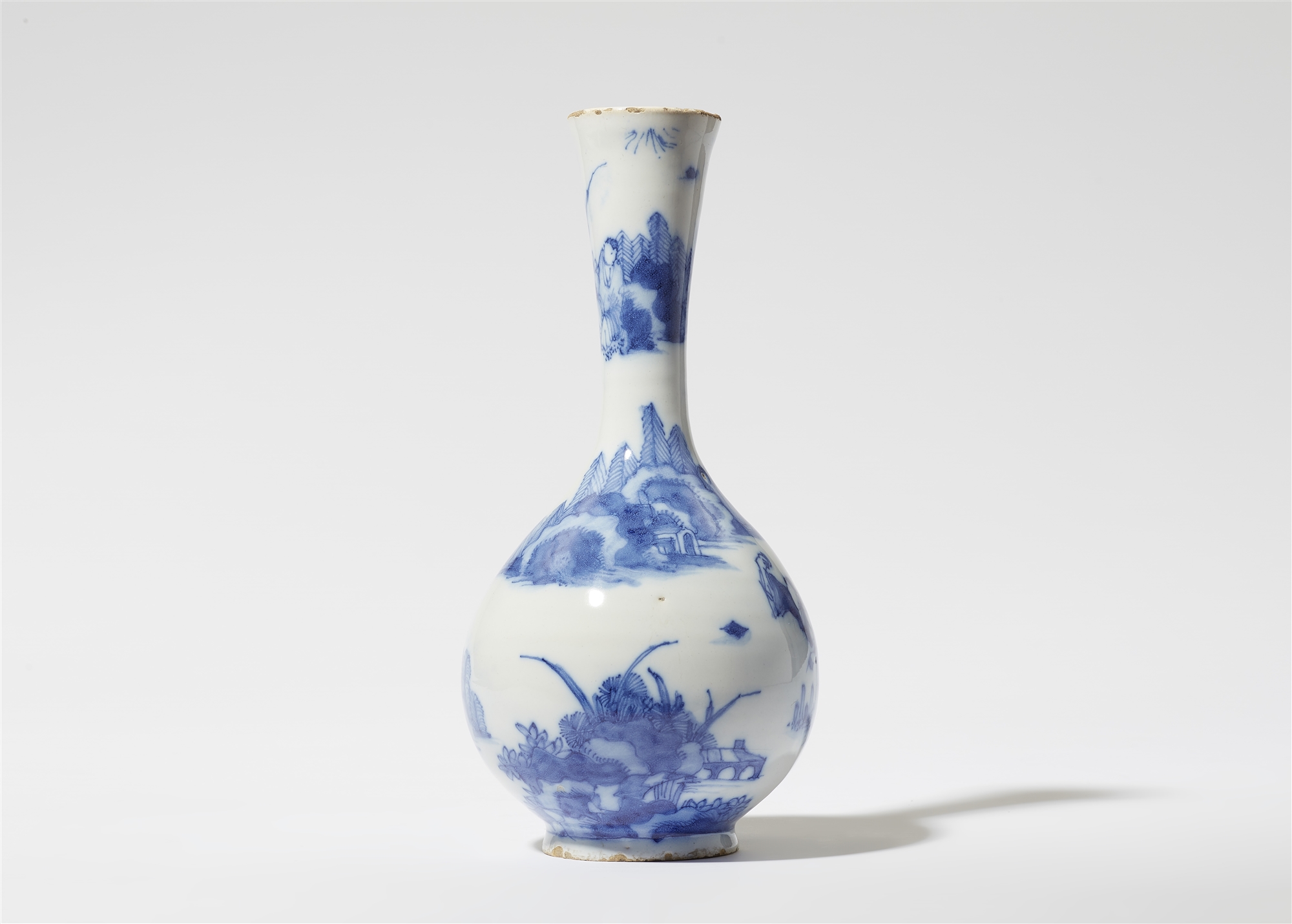 A small faience vase with Chinoiserie decor