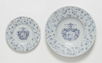 A faience dish and plate from a dated heraldic service