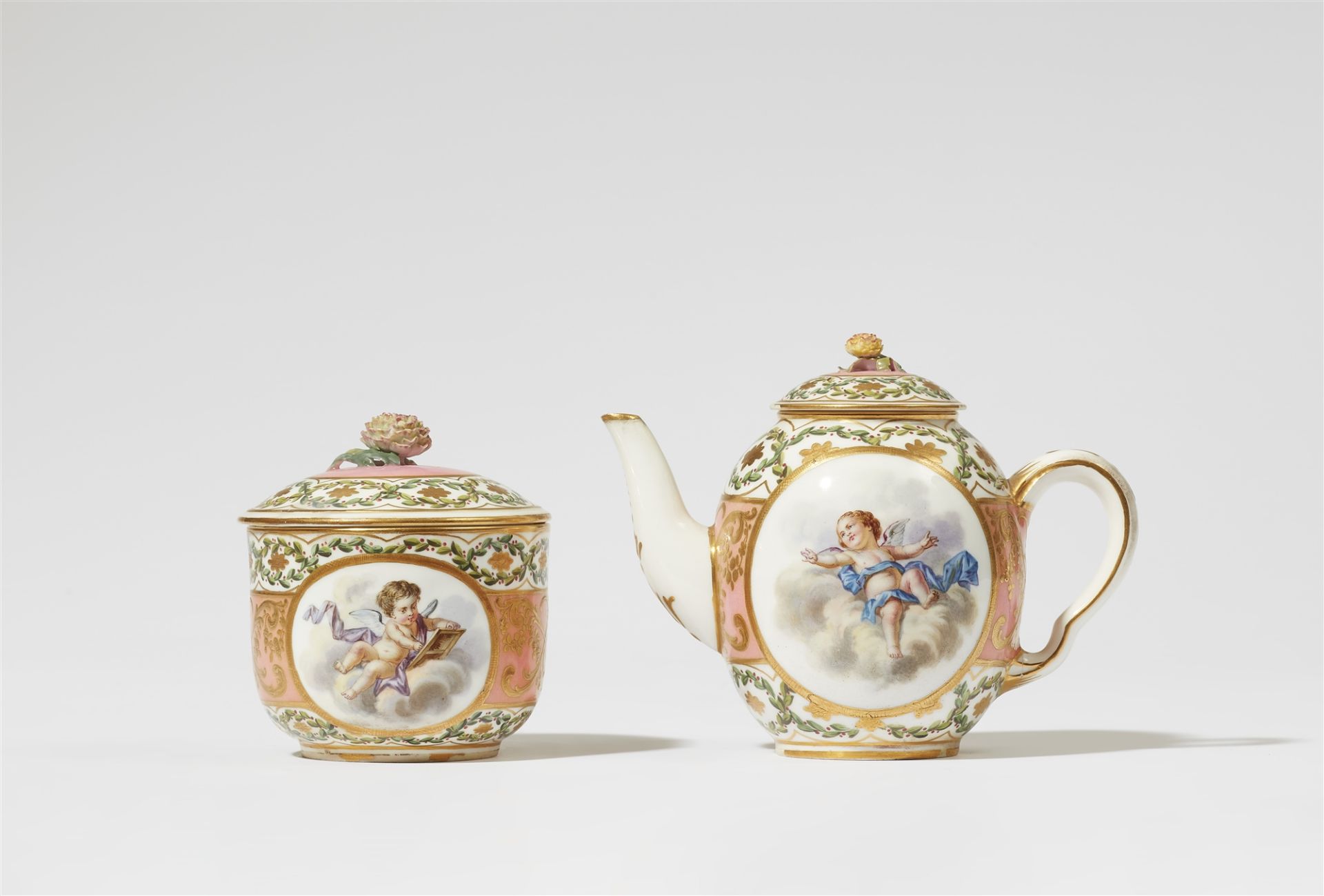 A Sèvres soft porcelain teapot and sugar box with putti