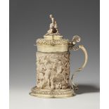 A museum-quality, silver gilt mounted ivory tankard