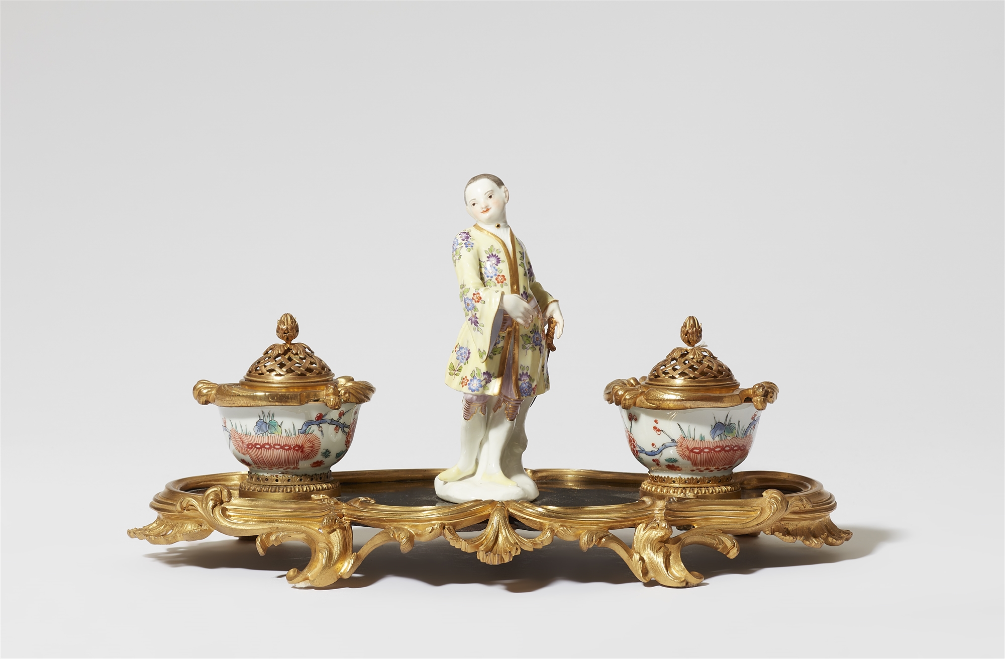 A Parisian ormolu writing set with a Meissen porcelain figure