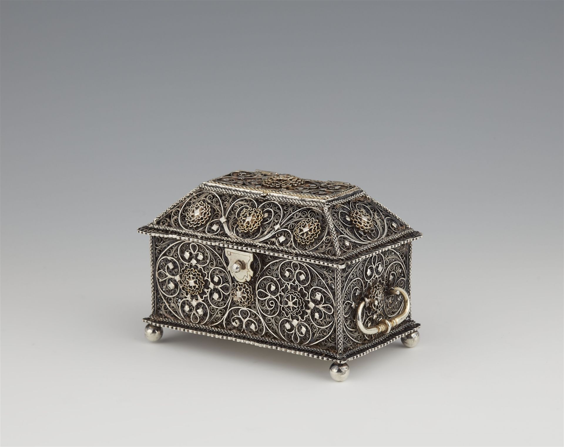 A parcel gilt silver filigree box
