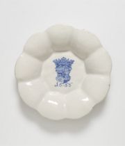 A dated faience dish with the Schenck zu Limburg coat of arms