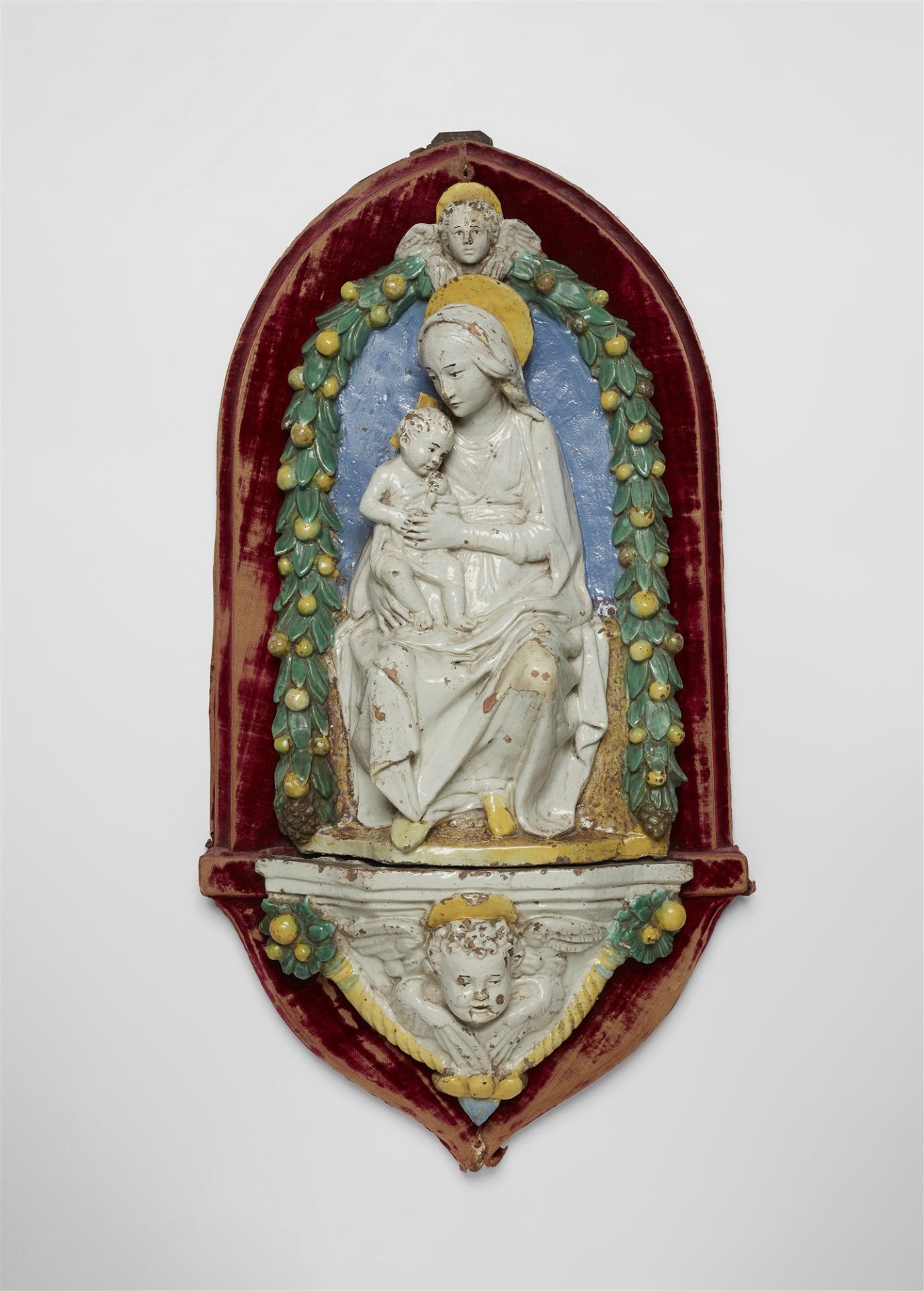 A Florentine terracotta relief of the Virgin and Child