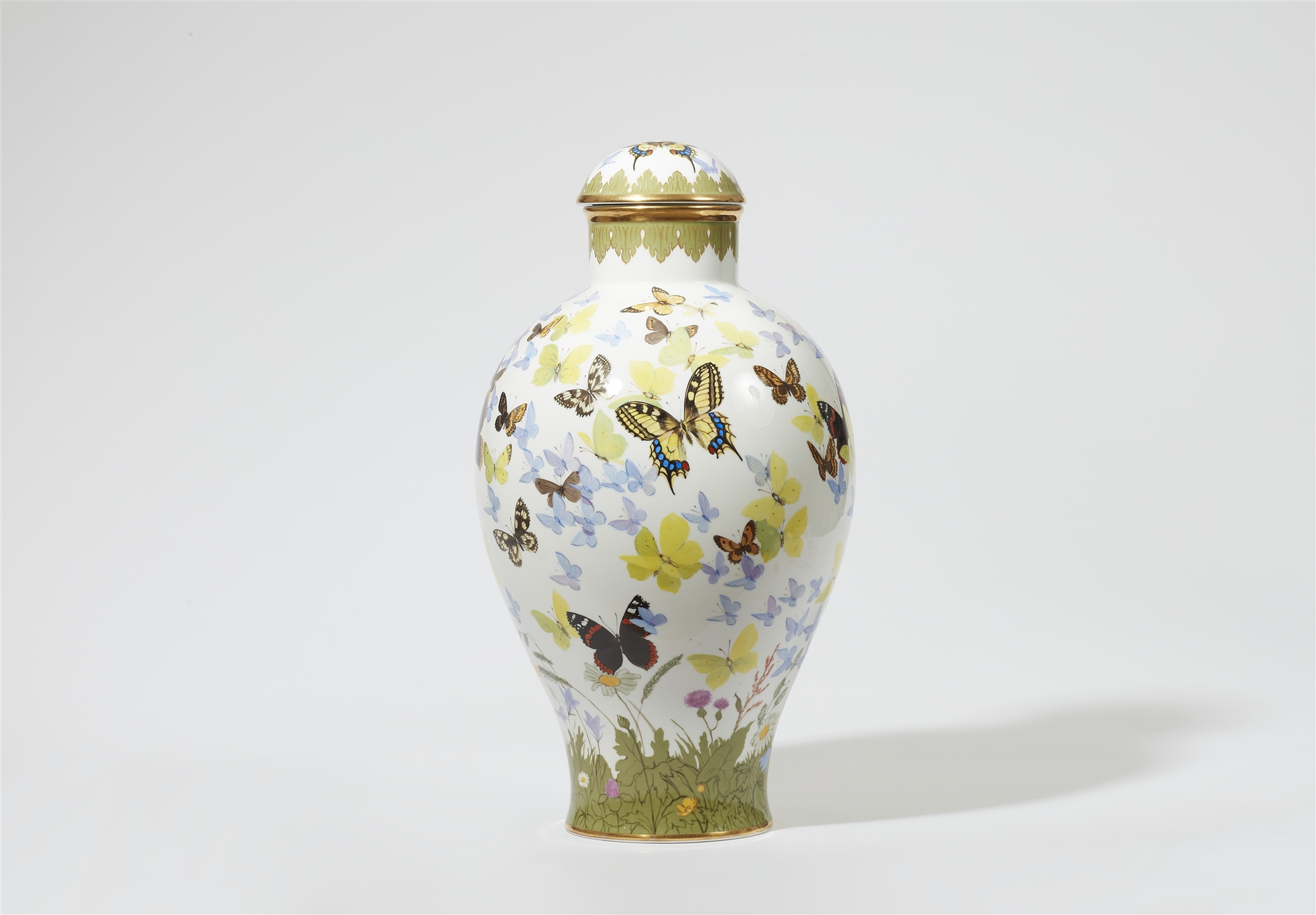 A Nymphenburg porcelain vase and cover with butterfly motifs