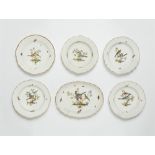 Five Meissen porcelain plates and an oval dish from a dinner service with native birds