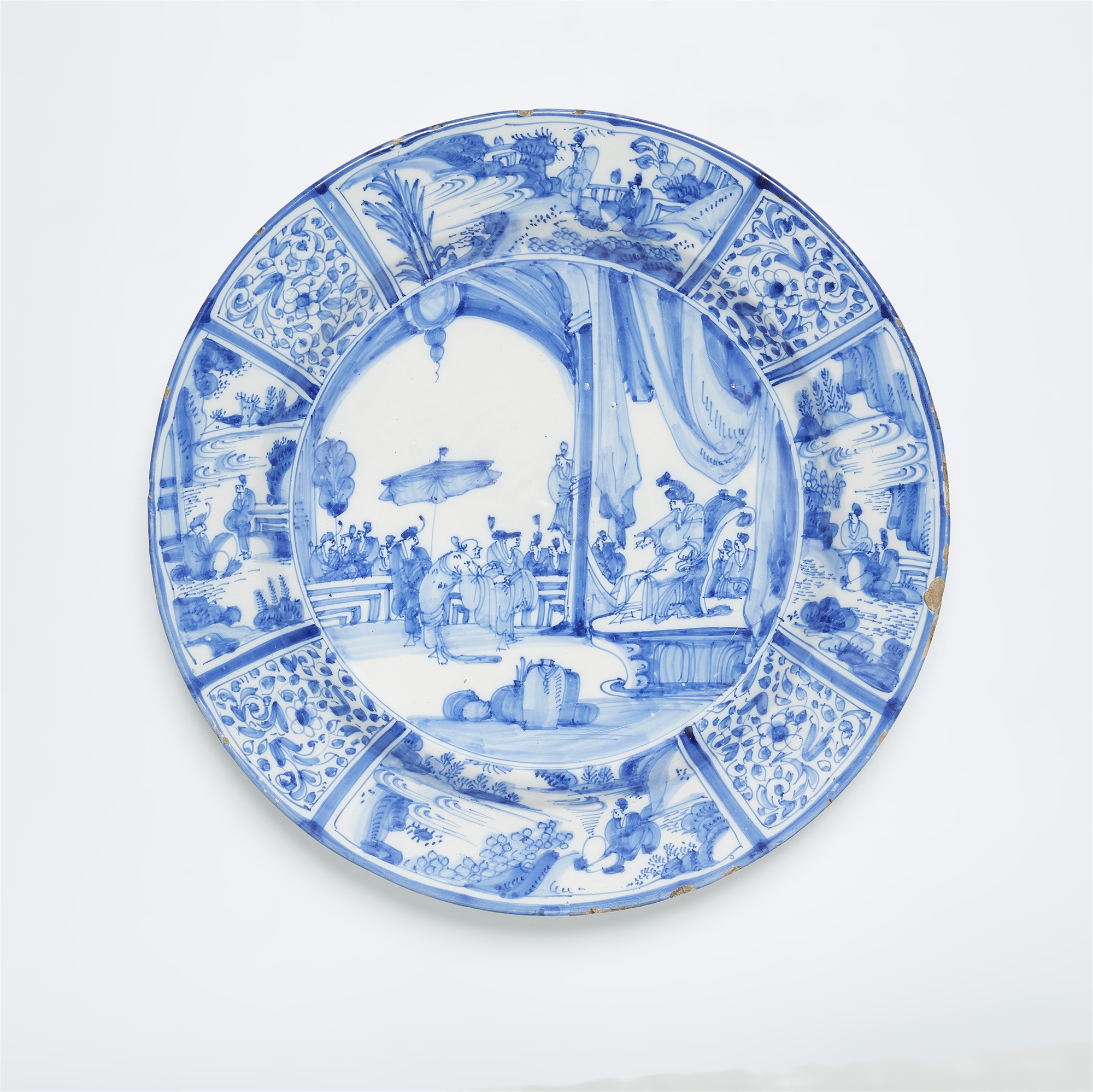 A Delftware dish with a rare Chinoiserie motif