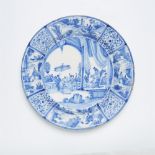 A Delftware dish with a rare Chinoiserie motif