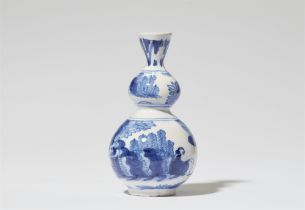 A faience gourd vase with Chinoiserie decor