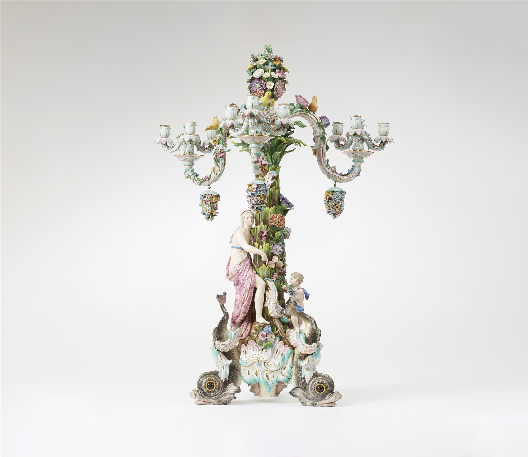 A large Meissen porcelain candelabra on dolphin supports