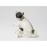 A large Meissen porcelain model of a pug dog and pup
