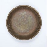 A Romanesque engraved bronze dish