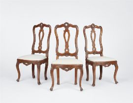 Three German Rococo carved walnut chairs