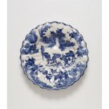 A rare faience fan dish with a "Spanish Chinoiserie"