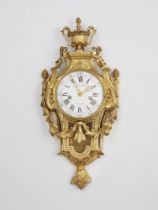 A Parisian Louis XVI ormolu cartel clock