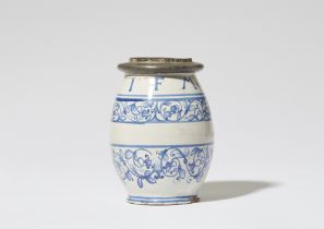 A faience albarello in the form of a barrel
