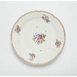 A Meissen porcelain dish from a dinner service with woodcut style flowers