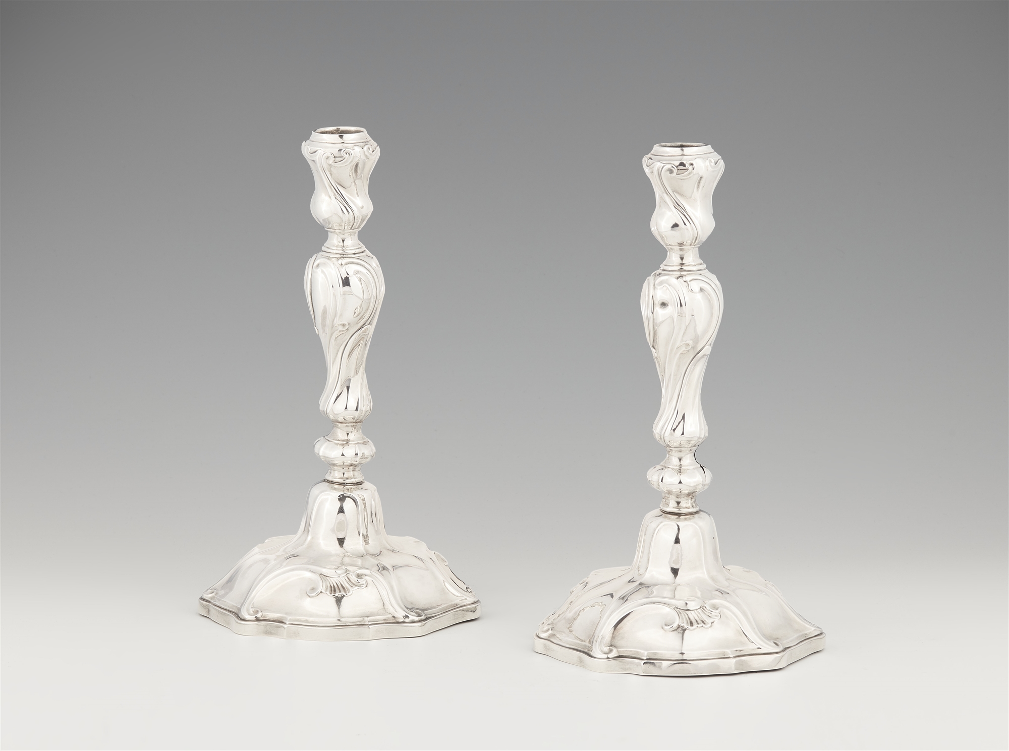 A pair of Mons silver candlesticks