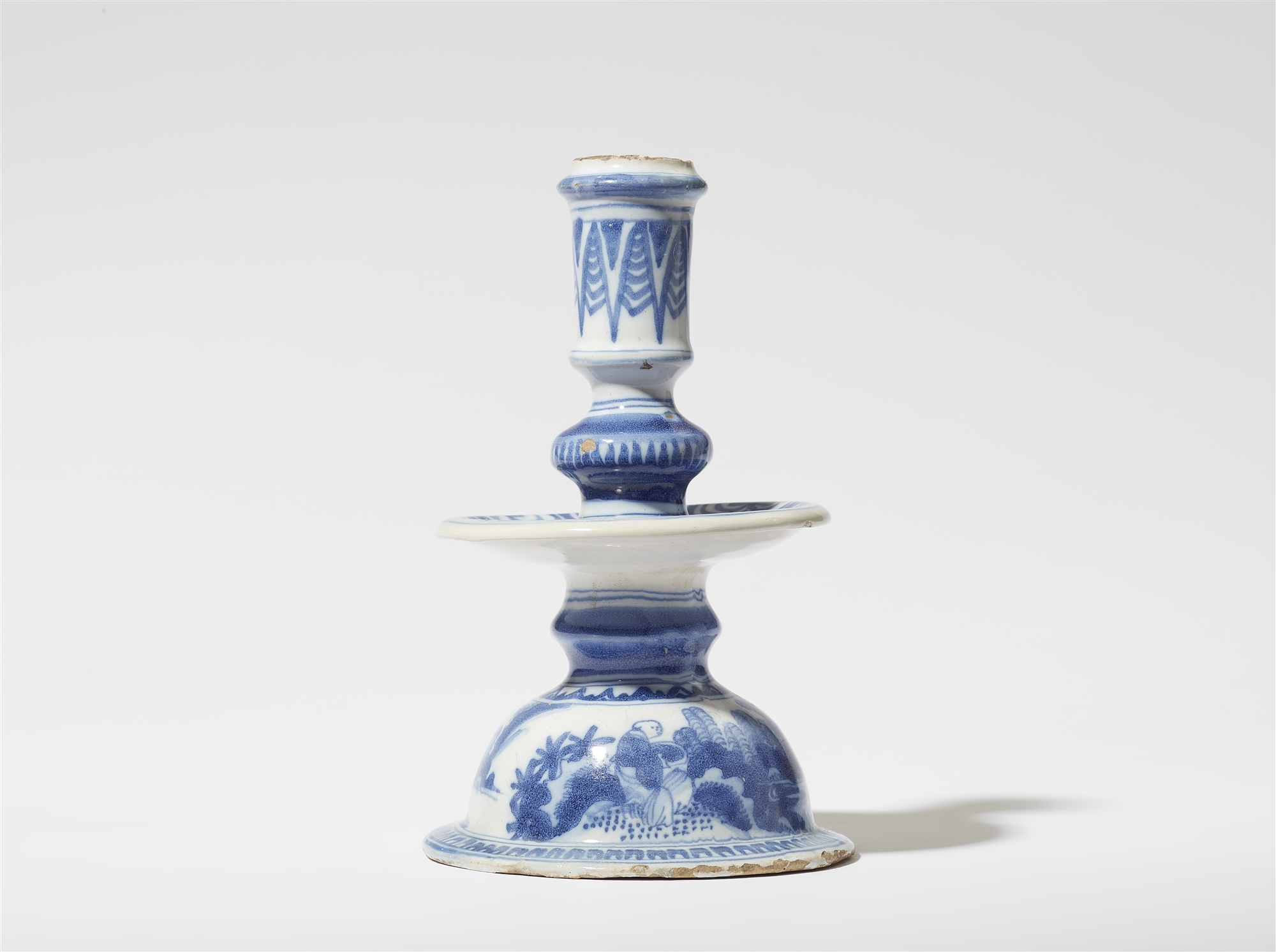 A faience candlestick with Chinoiserie decor
