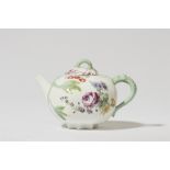 A Meissen porcelain teapot with floral finial
