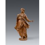 A carved limewood figure of St John from a Crucifixion by Johann Michael Fischer