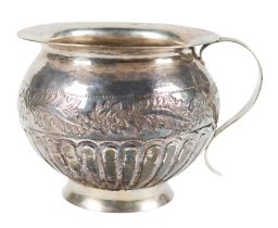 Embossed silver spittoon. Novohispanic or Viceregal work. Mexico or Peru. Late 18th century.