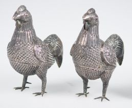 Pair of rooster-shaped jewelers in embossed silver. Viceregal school. Peru. 18th century.