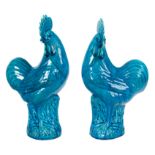 Pair of figures in turquoise blue glazed porcelain in the form of roosters. China. 20th century.