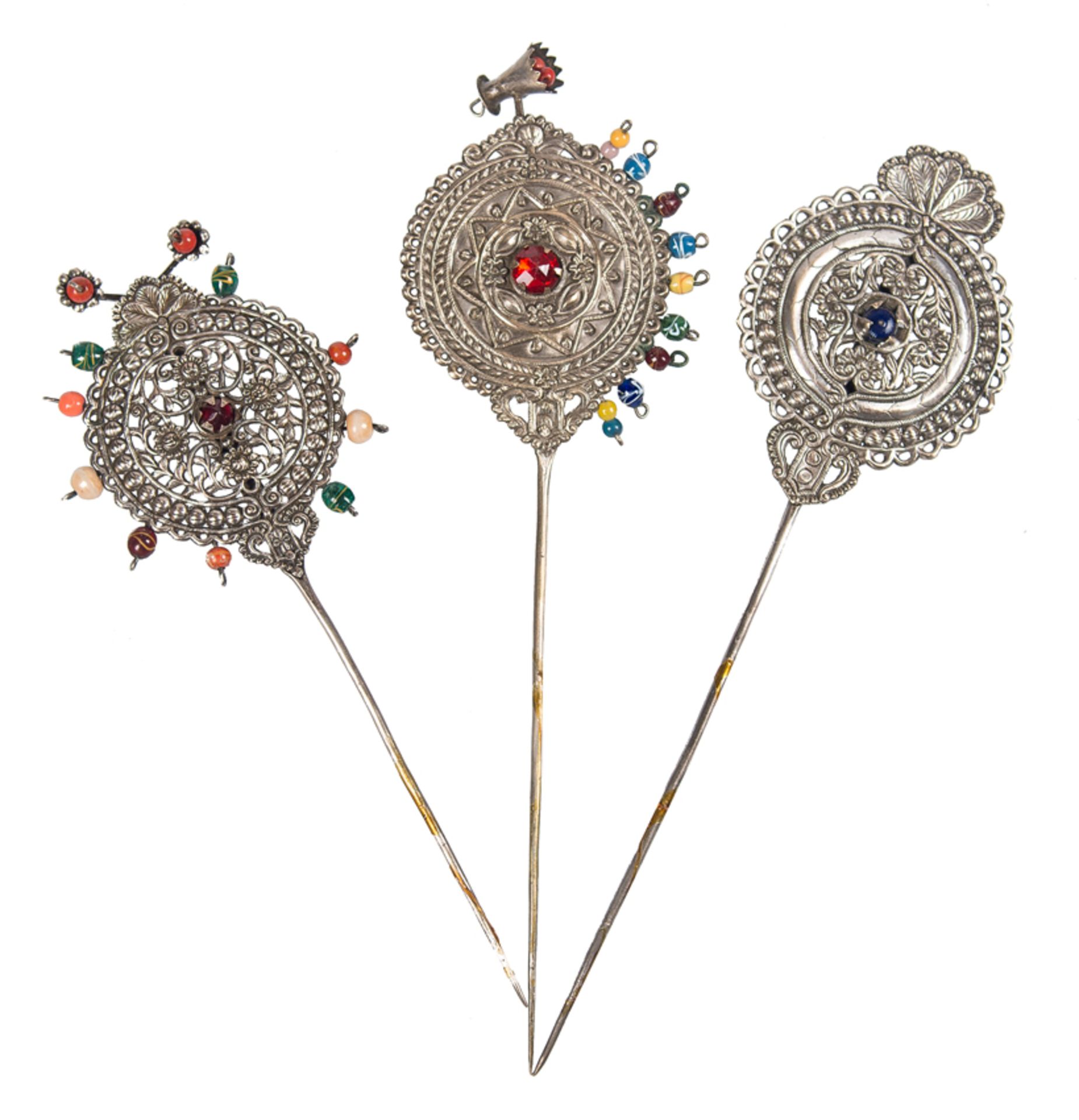 Collection of three tupus in silver and rhinestones. Viceregal work. Peru. 19th century.