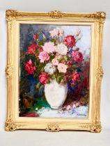 A large signed Dutch Still Life oil painting on canvas in a good quality ornate gilt frame. 59x79cm.