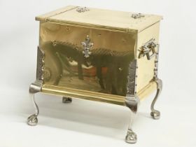 A large Georgian style brass and steel coal box on Ball & Claw feet. 46x37x45cm