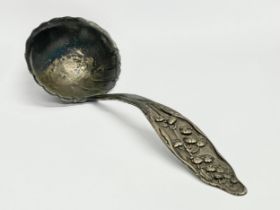 An ornate late 19th century Sterling Silver ladle. 69 grams.