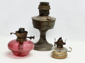 A Victorian Ruby Glass lamp bowl, an Edwardian finger lamp and other.