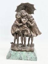 A good quality bronze ‘Girls in the Rain’ figure on marble base. In the manner of DH Chiparus.