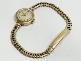 A vintage 9ct gold ladies Omega cocktail watch.