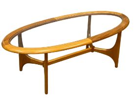 A Mid Century teak coffee table with glass top by Stonehill. 60x132cm