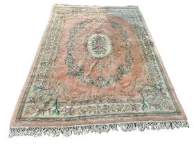 A large Middle Eastern style wool rug. 267x375cm