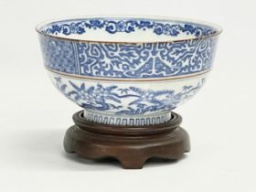 An early 20th century Japanese blue and white porcelain bowl on stand. 15.5x8cm