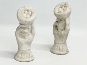 A pair of early 20th century bisque hand garnitures. 19cm