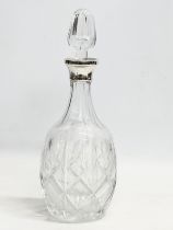 A silver mounted crystal decanter. 30.5cm