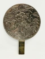 A late 19th century Japanese bronze hand mirror. Decorated with cranes and tree. 23x32cm