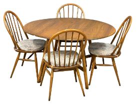 An Ercol Mid Century dining table and 4 chairs. Open 125x113x72.5cm