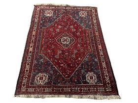 A large vintage Middle Eastern hand knotted rug. 189x268cm