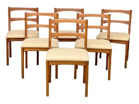 A set of 6 Mid Century teak dining chairs.