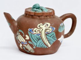 An early 20th century Chinese Yixing teapot. 16x11x9cm