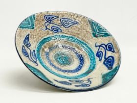 An early to mid 20th century Middle Eastern hand painted terracotta bowl. 26cm