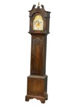 An early 20th century oak long case clock with brass and pendulum. 197cm