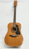 A 1960’s-1970’s Shaftsbury guitar with a leather case.